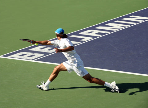 Tennis Player Reaching for the Ball / 100413