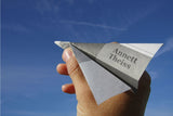 Hand Holding a Paper Airplane / 100503