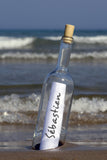 Message In a Bottle Standing On Blurry Sea Shore / 100528