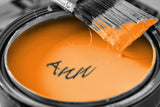 Tin Of Orange Paint and Brush Closeup / 100507